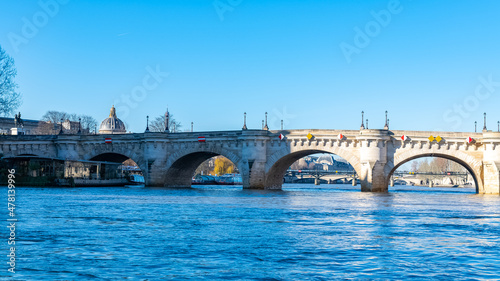 Paris, the Pont-Neuf on the Seine, typical panorama, with the dome of the Institut de France in background 
