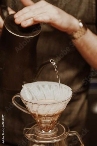 pouring water into a v60, brewing coffee