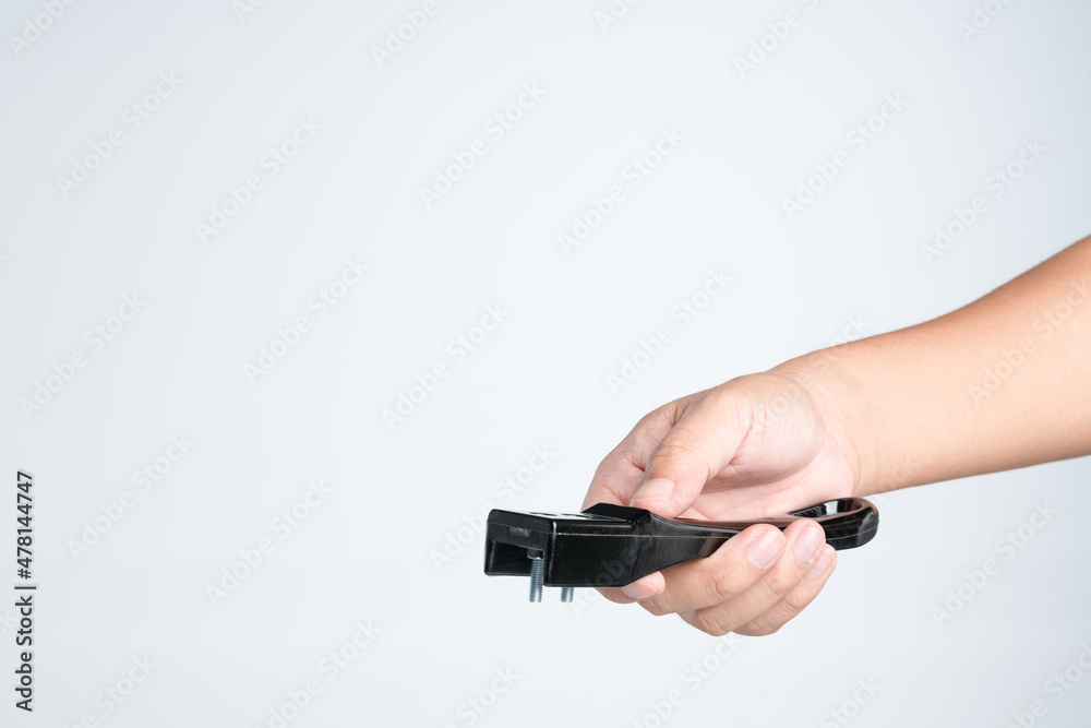 Hand holding stainless steel handle as a spare part Hand holding stainless steel handle as a spare part