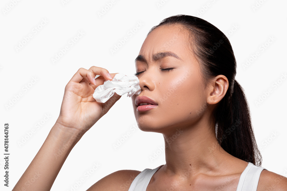 Young asian woman suffering with nasal bleeding, free space Young asian woman suffering with nasal bleeding, free space