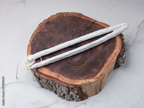 salami on a light background