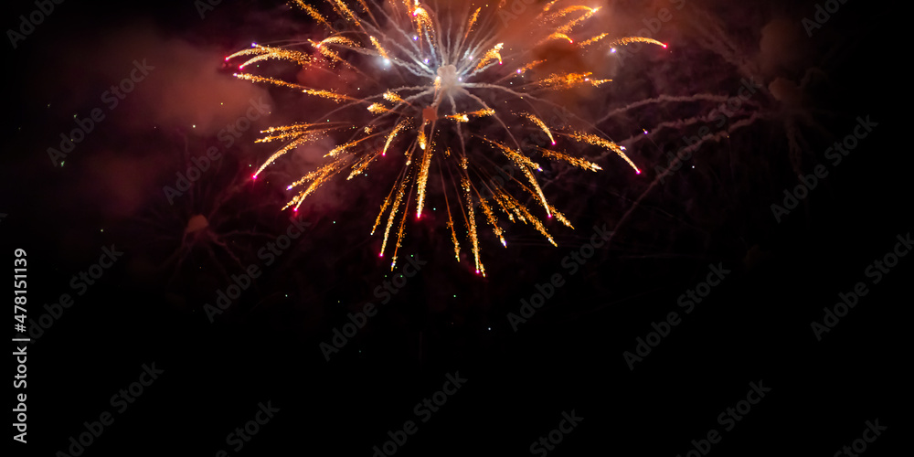 Fireworks on deep black background sky, beautiful colorful fireworks shiny display at night ,fireworks  a class of low explosive pyrotechnic devices used for aesthetic 