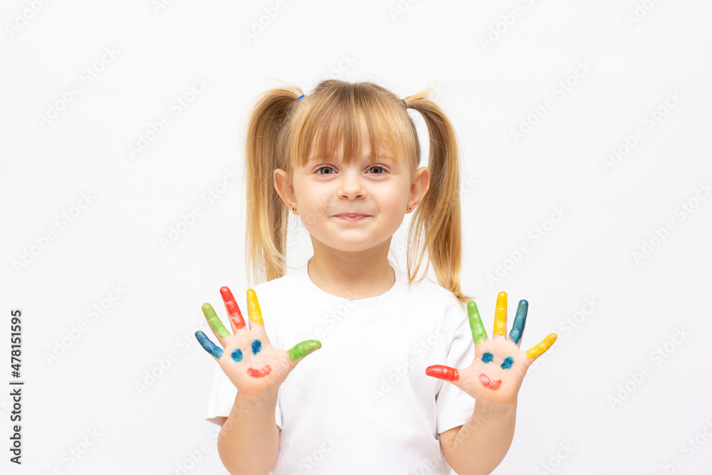 Happy cute little girl with colorful painted hands isolated on a white education concept Happy cute little girl with colorful painted hands isolated on a white education concept