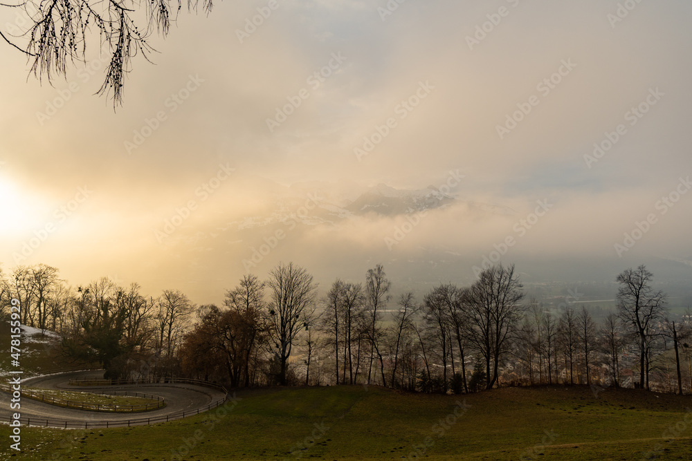 Vaduz, Liechtenstein, December 14, 2021 Foggy rhine valley in the afternoon Vaduz, Liechtenstein, December 14, 2021 Foggy rhine valley in the afternoon