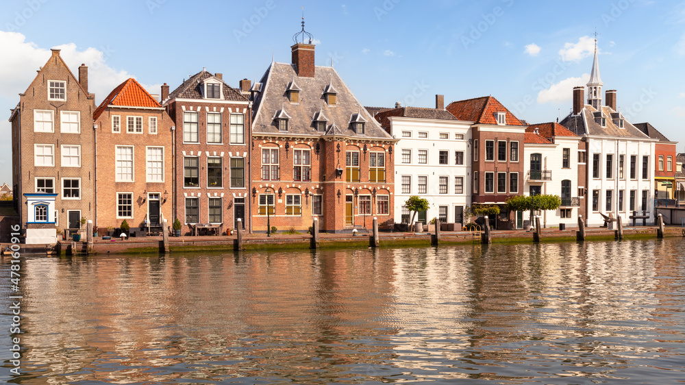 Canal houses along the quay of the old harbor in Maassluis in the Netherlands.