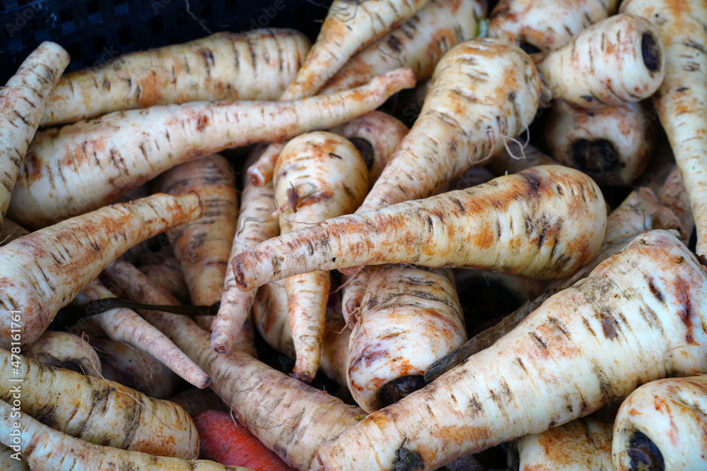 Fresh parsnips at a farmers market Fresh parsnips at a farmers market