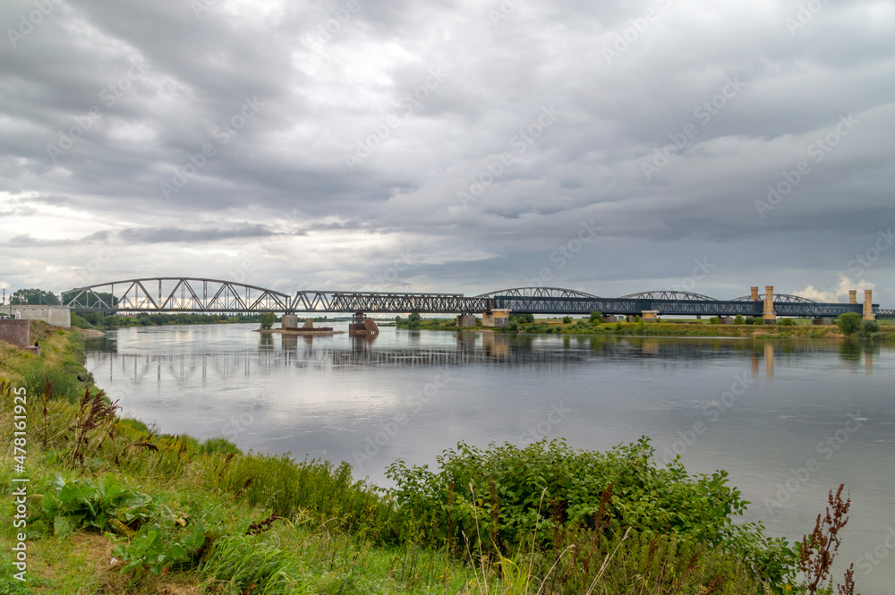 Old bridges over Vistula river at cloudy day in Tczew, Poland.