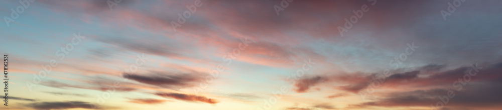 Sunrise with orange and pink clouds. Panoramic, panorama, banner.