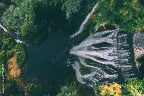 Big waterfall. Top view of water drop from drone. Waterfall Marmore, Cascata delle Marmore, in Umbria, Italy. The tallest man-made waterfall in the world.