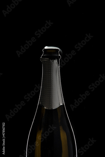 Opened champagne bottle in studio graphically presented