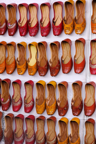 Colorful Handmade chappals (sandals) being sold in an Indian market, Handmade leather slippers, Traditional footwear.