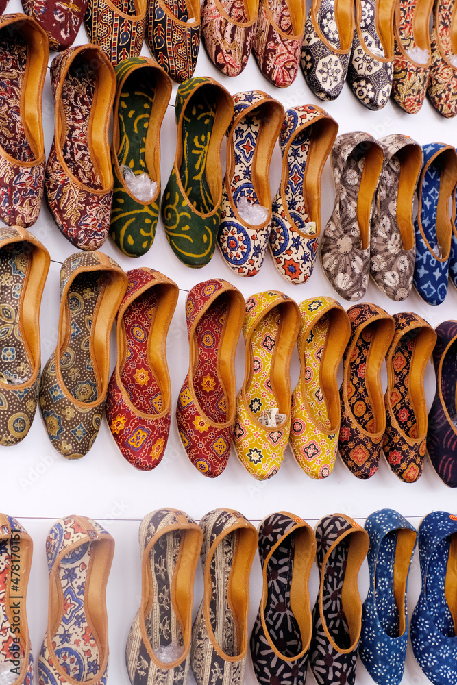 Colorful Handmade chappals (sandals) being sold in an Indian market,  Handmade leather slippers, Traditional footwear. Stock Photo | Adobe Stock