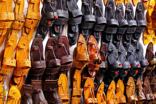 Colorful Handmade chappals (sandals) being sold in an Indian market, Handmade leather slippers, Traditional footwear.