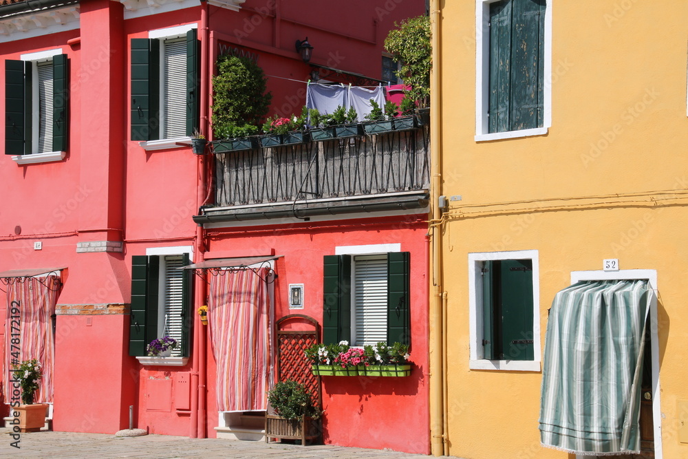 There are colorful apartments on Burano  Island which is close to Venice.
