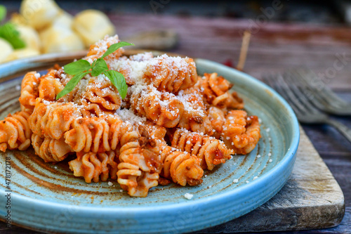  Home made italian   radiatori bolognese fresh   pasta  on rustic background. Mediterranean food concept photo