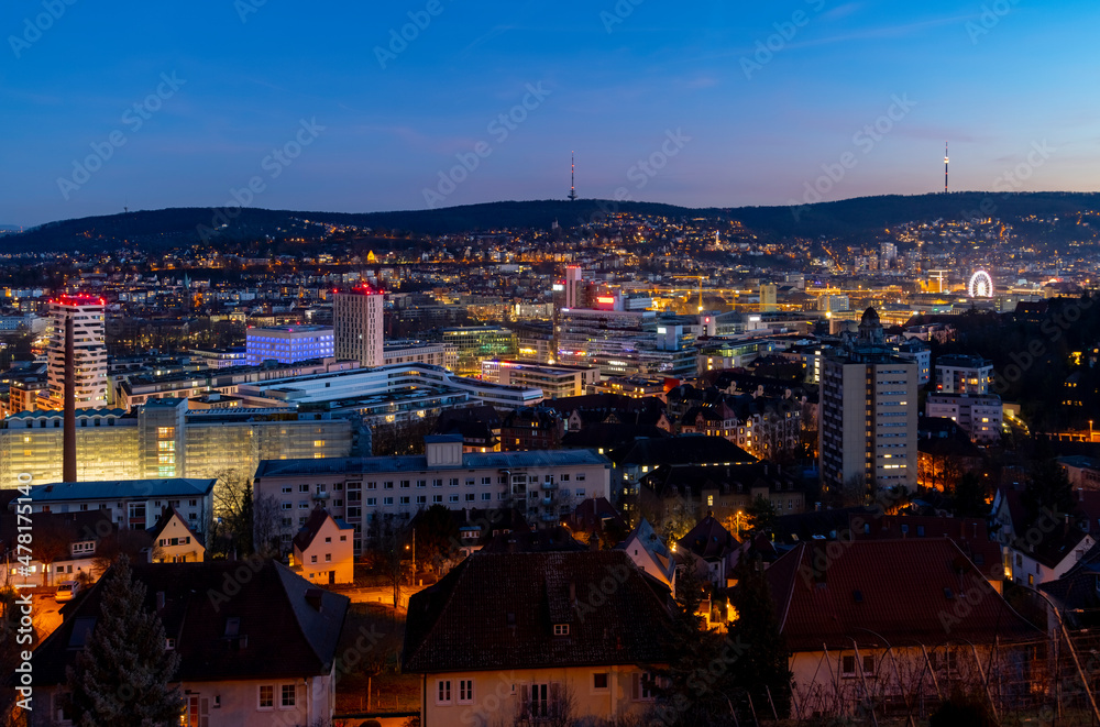 Stuttgart Cauldron colorful nighttime panorama. Illuminated town at winter holidays evening blue hour with TV Towers and modern buildings. Capital of Baden-Württemberg and Cradle of the automobile.