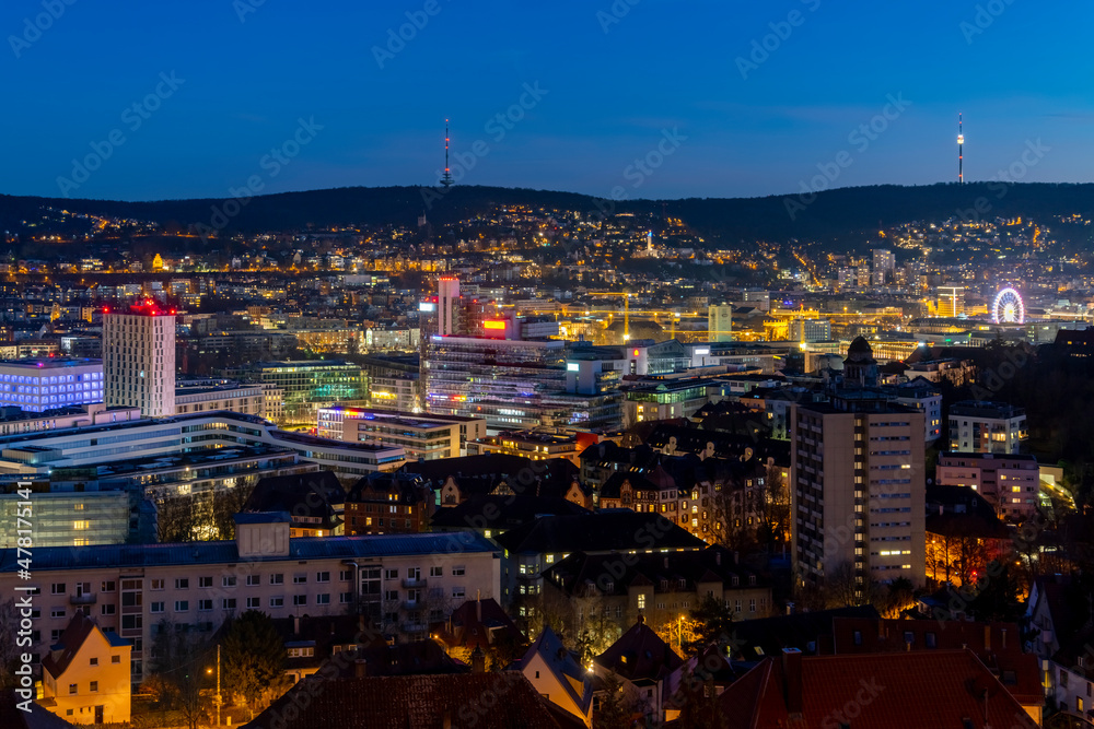 Stuttgart Cauldron nighttime panorama. Illuminated town at winter evening blue hour with hundreds of lights. Capital and largest city of the German state of Baden-Württemberg.  Cradle of automobile.
