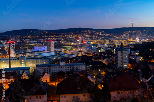 Stuttgart Cauldron colorful nighttime panorama. Illuminated town at winter holidays evening blue hour with TV Towers and modern buildings. Capital of Baden-W  rttemberg and Cradle of the automobile.