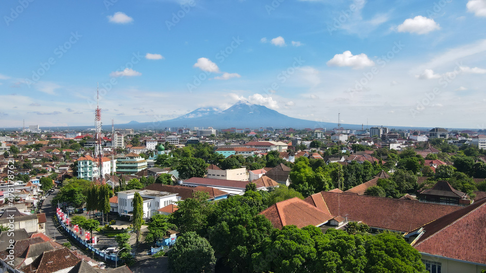 Aerial view, the morning view of the city of Yogyakarta and the magnificent Mount Merapi.