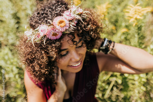 Black woman wearing pink flower crown photo