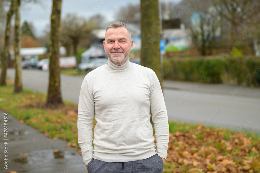 Attractive senior man with a happy friendly smile Attractive senior man with a happy friendly smile