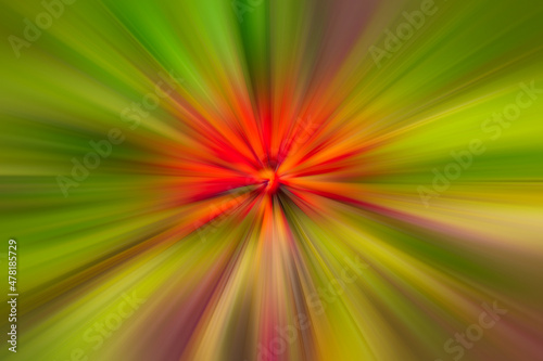 Bright red boom with green and purple rays