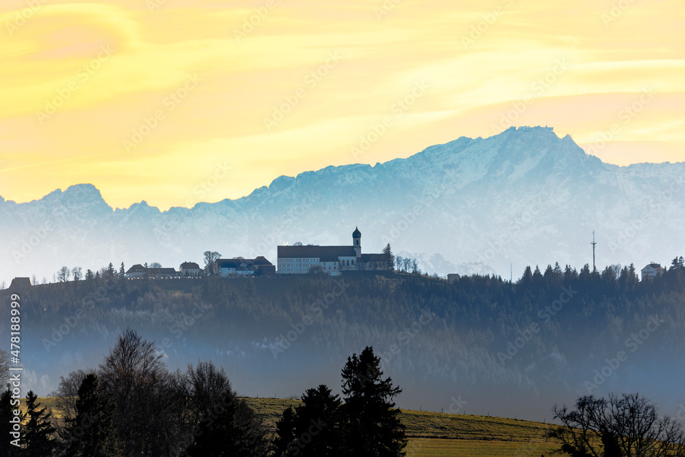 Pilgrimage church on the Hohe Peissenberg with the mountain panorama of the Ammergaues Alps in the background