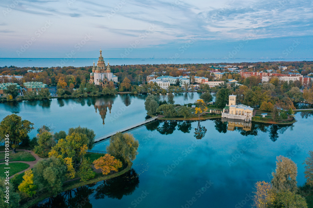 Panoramic aerial view of Holgin pond and the islands with pavilions in Peterhof,Peter and Paul Cathedral, wooden bridge to the island, reflected in the water, photo for a postcard
