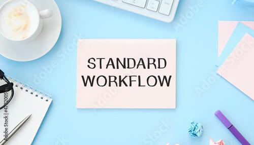 STANDARDS text on notebook and other office equipment such as computer keyboard, cup coffe.