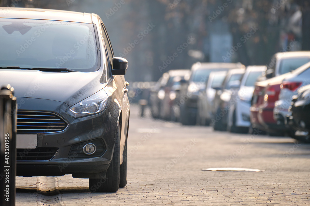 Close up of a car parked illegally against traffic rules on pedestrian city street side