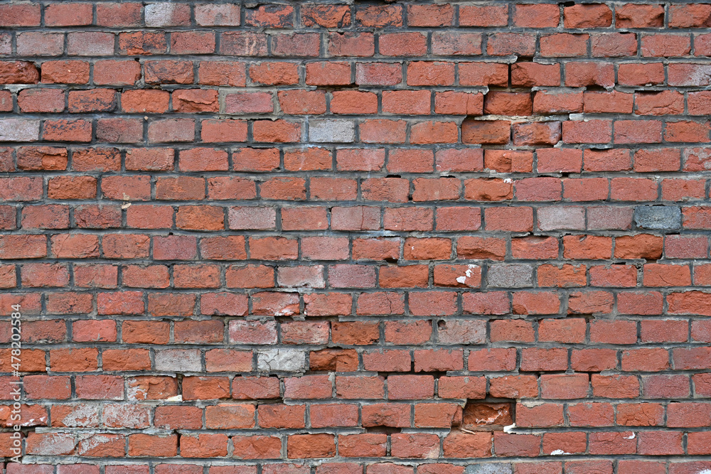 Fototapeta premium Texture of a wall from old red bricks.