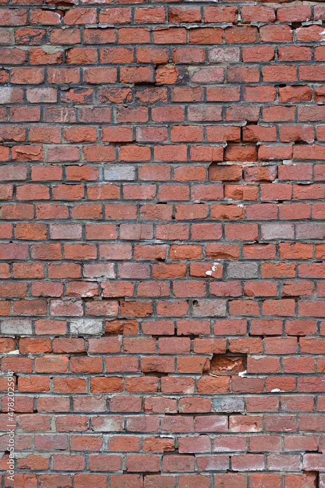 Fototapeta premium Texture of a wall from old red bricks.