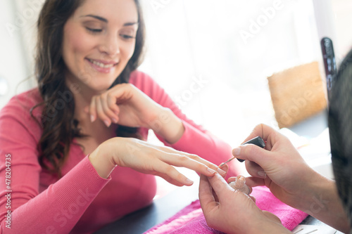two women having her nails done