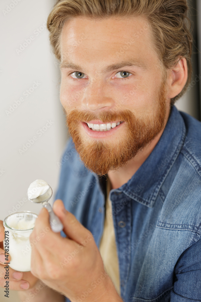 happy man is having breakfast