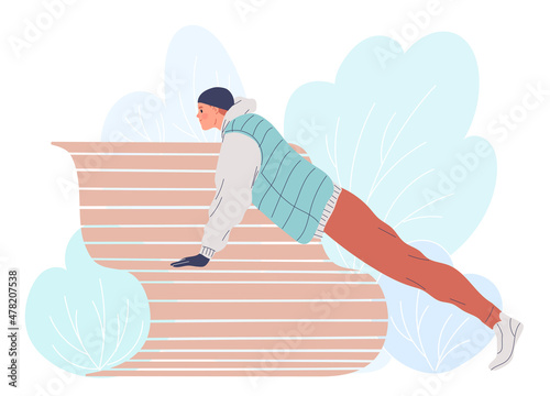 Man training outside in the winter doing push-ups