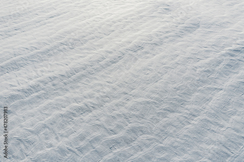 Snow-covered white fields in Alsace, top view. White desert.