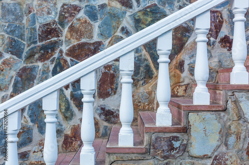 Fototapeta Stone baroque baluster and staircase, stone wall.