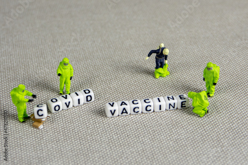 the team of miniature figurines of special doctor forces, making a decision about covid restrictions and vaccination plan, is it all a plandemic prepared years before? photo