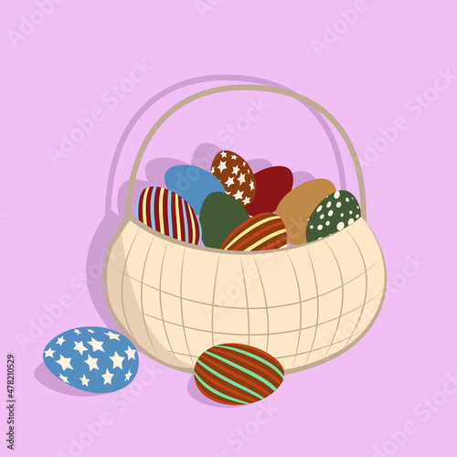 Basket with patterned eggs on a pink background