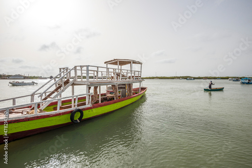 Barco de excursiones atracado en la Marina de Oyster Creek de Banjul, Gambia photo