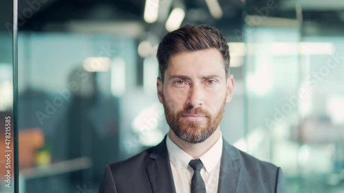 Wallpaper Mural portrait successful confident Caucasian bearded male office worker standing and looking at camera in formal suit indoors. face of a business man or entrepreneur employee crossed arms. In modern glass Torontodigital.ca