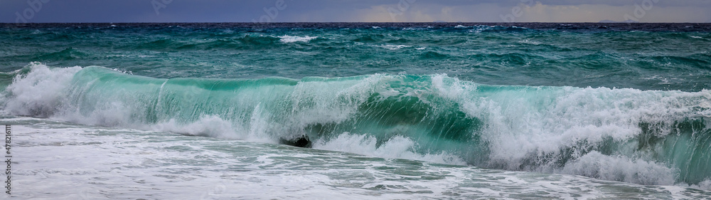 Waves at the beach on cloudy and stormy weather Waves at the beach on cloudy and stormy weather