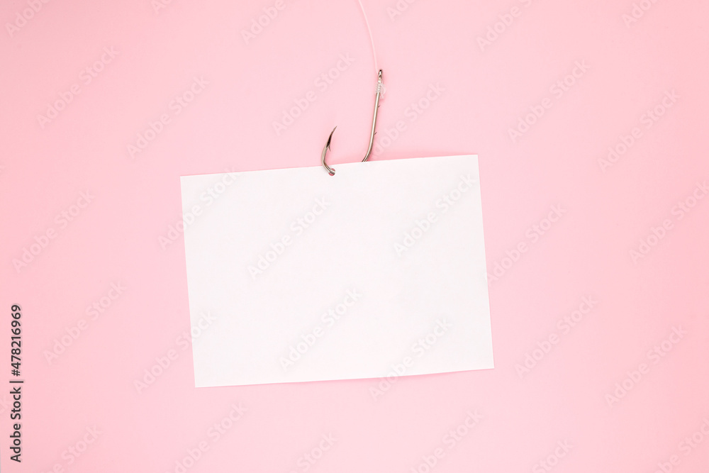 White paper sheet for text and fishing hook with fishing line on pink background. Design element, copy space White paper sheet for text and fishing hook with fishing line on pink background. Design element, copy space