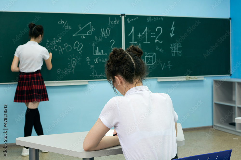 asian high school girl solves geometry on the blackboard asian high school girl solves geometry on the blackboard