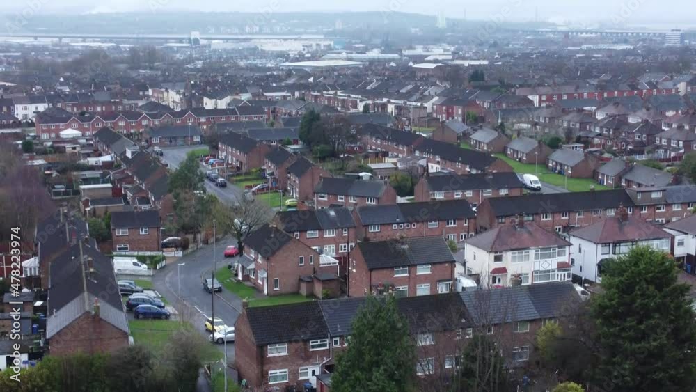 Aerial view rows northern England terraced town houses residential neighbourhood in overcast winter season rising push in Aerial view rows northern England terraced town houses residential neighbourhood in overcast winter season rising push in