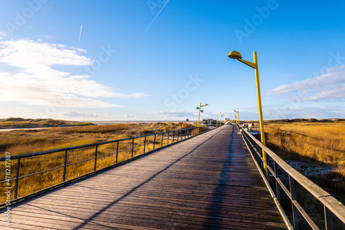 Pier over the dunes at the Wadden Sea in North Frisia - travel photography photo