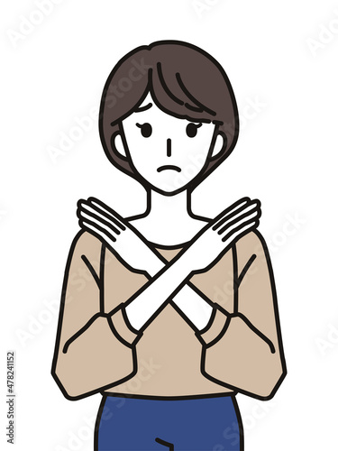 手でばつのジェスチャーをする女性