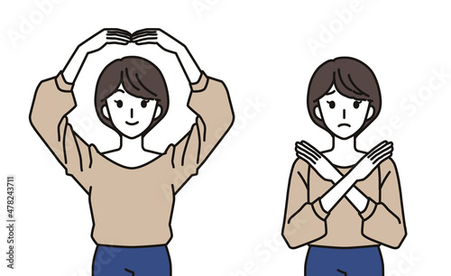 まるばつのジェスチャーをする女性