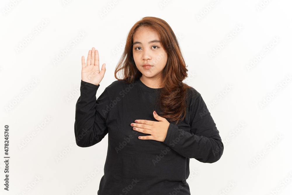 Swearing or Promise Gesture Of Beautiful Asian Woman Wearing Black Shirt Isolated On White Swearing or Promise Gesture Of Beautiful Asian Woman Wearing Black Shirt Isolated On White