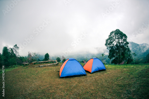 landscape tent in morning mist winter season background